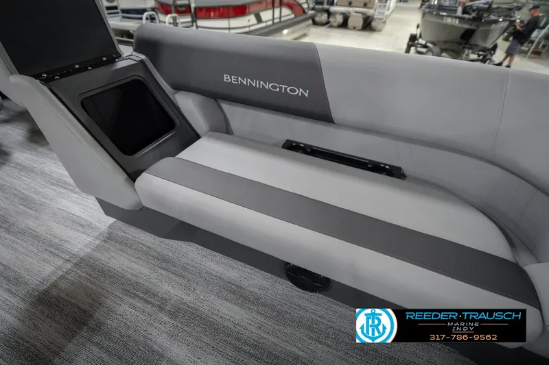 Slide: The Image of 2026 Bennington 22 SSB boat interior seating with storage compartment, showcased at Reeder Trausch Marine. - 24