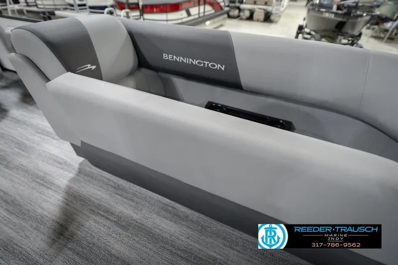 Slide: The Image of 2026 Bennington 22 SSB boat interior seating, gray upholstery, showroom display. - 25