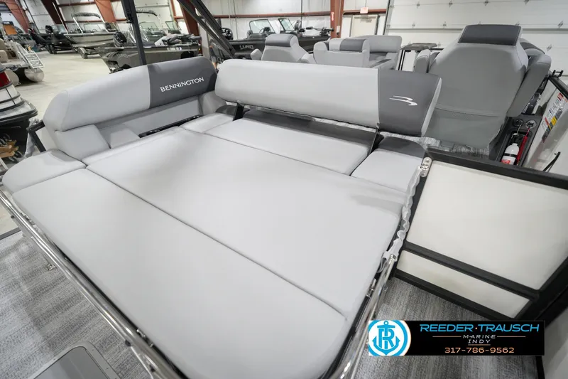 Slide: The Image of 2026 Bennington 22 SSB boat interior with spacious seating in showroom. - 28