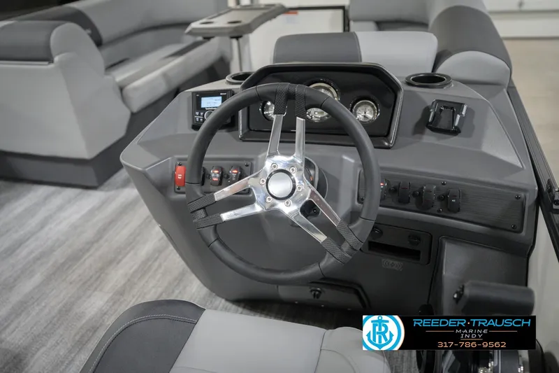 Slide: The Image of 2026 Bennington 22 SSB boat dashboard with steering wheel and control panel. - 30