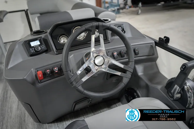 Slide: The Image of 2026 Bennington 22 SSB boat dashboard with steering wheel and control panel. - 31