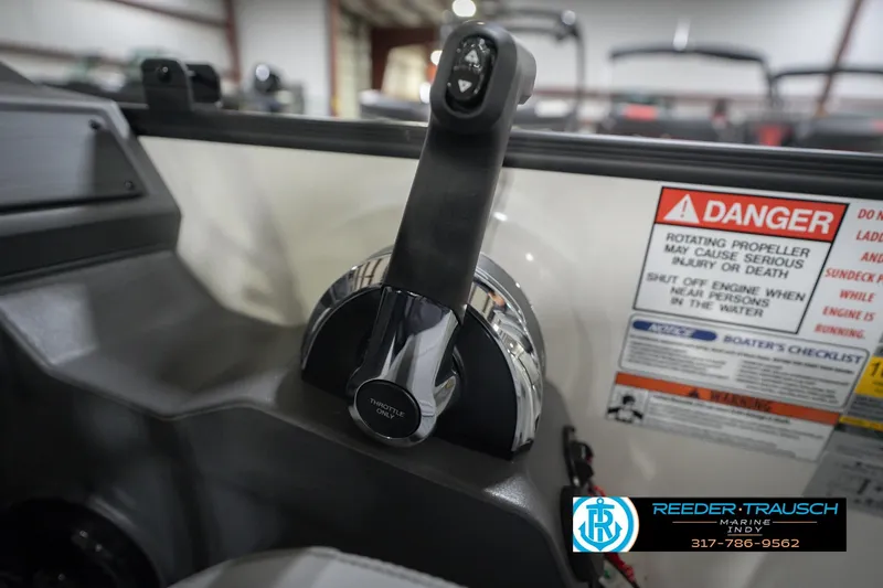 Slide: The Image of Throttle control of 2026 Bennington 22 SSB boat with safety warning labels. - 38