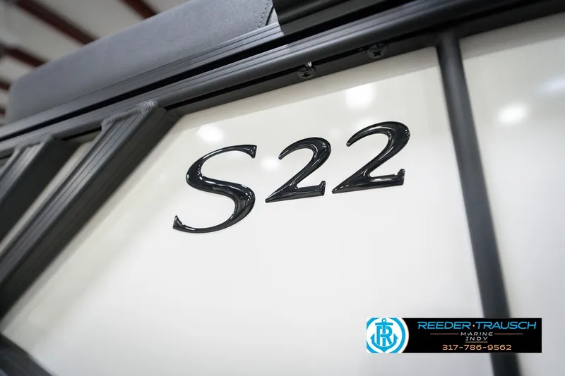 Slide: The Image of 2026 Bennington 22 SSB boat with "S22" emblem, showcased at Reeder-Trausch Marine. - 50
