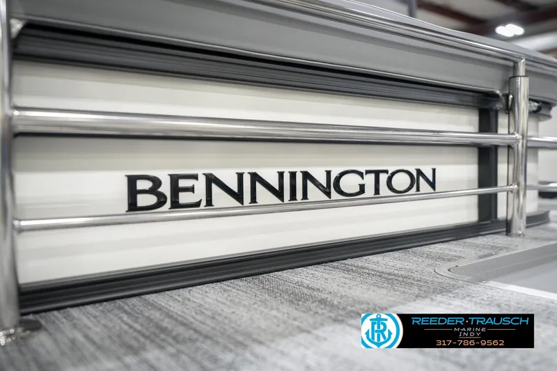 Slide: The Image of 2026 Bennington 22 SSB boat with sleek metal railings and logo detail. - 57
