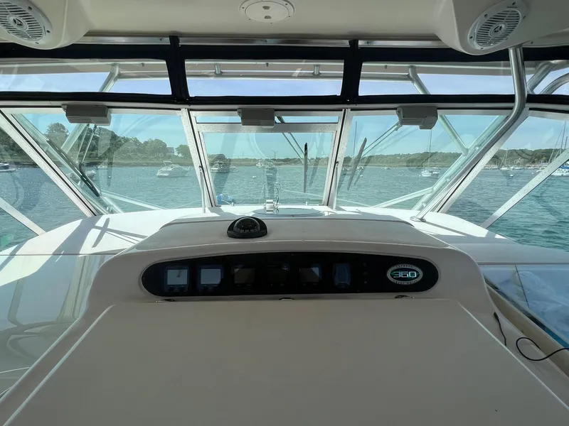 Slide: The Image of 2006 Grady-White Express 360 boat interior with dashboard view, overlooking calm waters. - 10