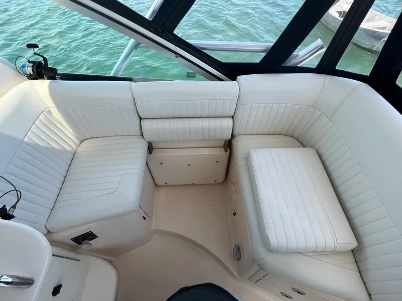 Slide: The Image of 2006 Grady-White Express 360 boat interior with white cushioned seating. - 11