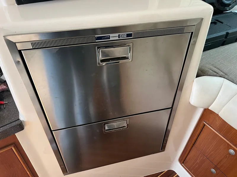 Slide: The Image of Stainless steel refrigerator drawers on 2006 Grady-White Express 360 boat interior. - 18