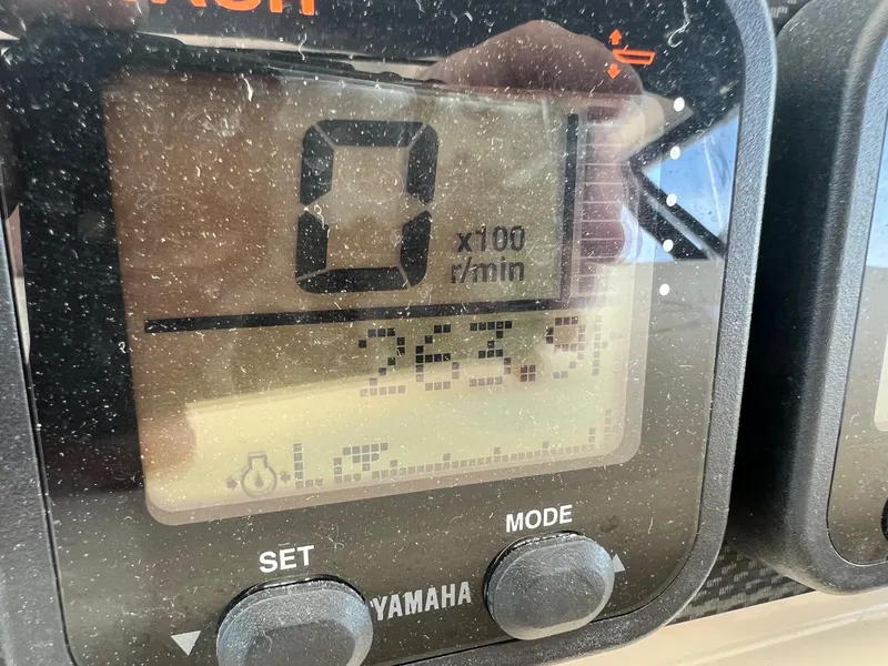 Slide: The Image of Close-up of a Yamaha boat gauge on a 2006 Grady-White Express 360. - 22
