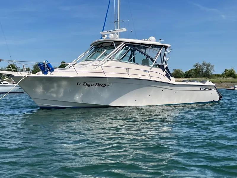 Slide: The Image of 2006 Grady-White Express 360 boat on water, clear sky, side view. - 4