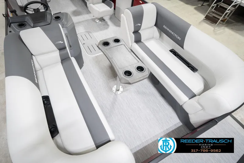 Slide: The Image of 2026 Bennington 22 SSR pontoon boat interior with gray and white seating and cup holders. - 11