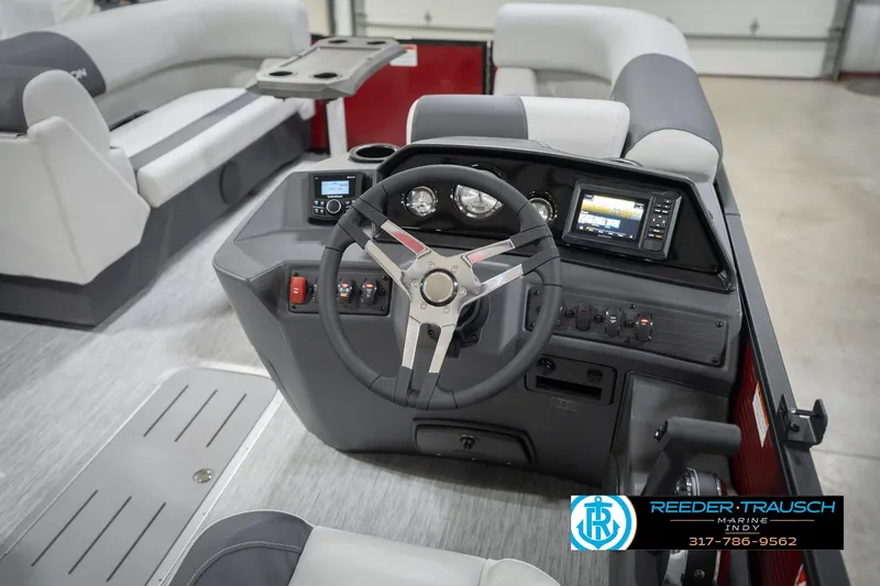 Slide: The Image of 2026 Bennington 22 SSR boat interior with modern steering and control panel. - 29