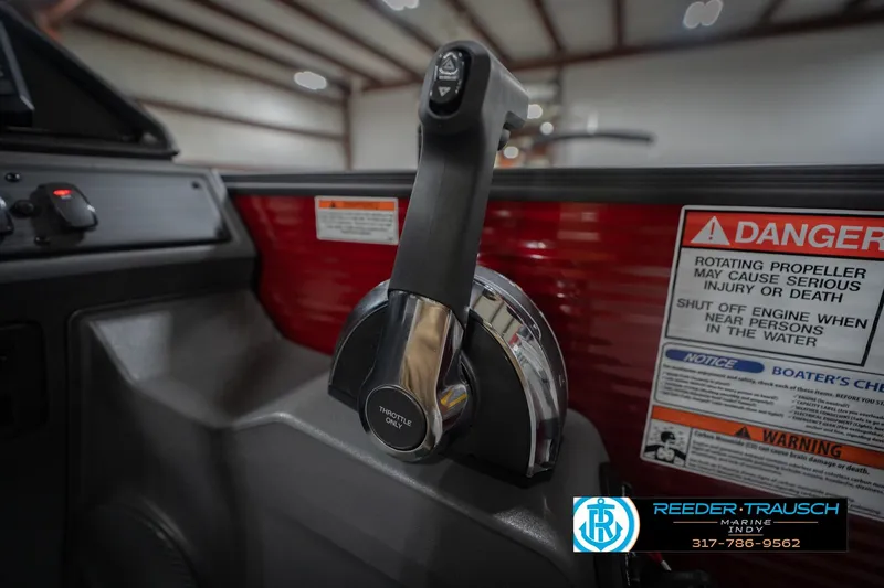 Slide: The Image of Throttle control of 2026 Bennington 22 SSR boat with safety warning labels. - 37