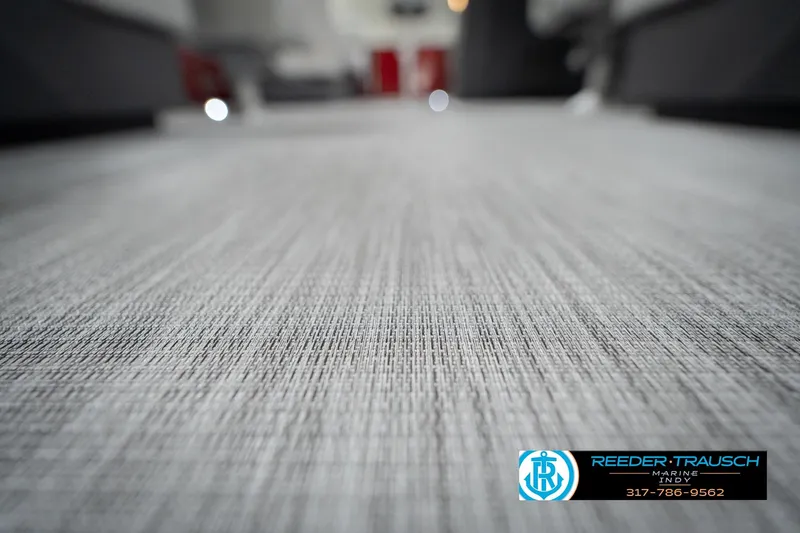 Slide: The Image of 2026 Bennington 22 SSR boat flooring with textured design, Reeder-Trausch Marine logo visible. - 40