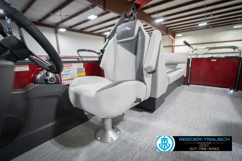 Slide: The Image of 2026 Bennington 22 SSR boat interior with modern seating and steering wheel. - 41