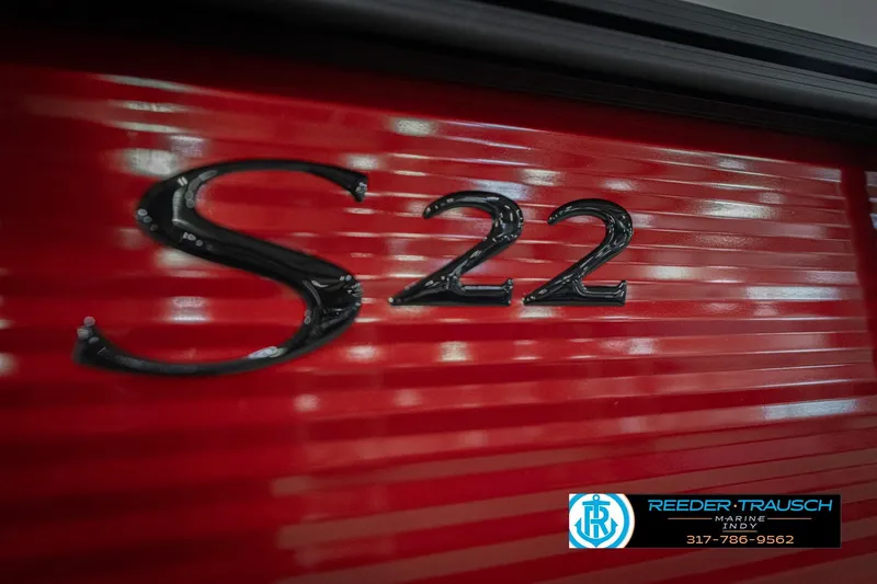 Slide: The Image of Red Bennington 22 SSR boat with "S22" emblem, 2026 model. - 47