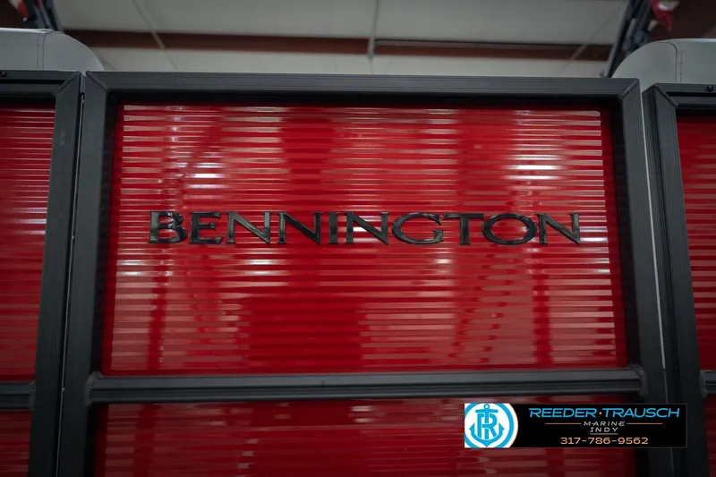 Slide: The Image of 2026 Bennington 22 SSR boat with red paneling and logo, Reeder-Trausch Marine contact info. - 48