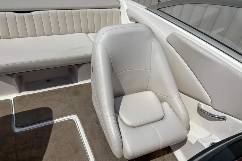 Slide: The Image of 2008 Regal 1900 Bowrider interior with beige seating and carpeted flooring. - 10