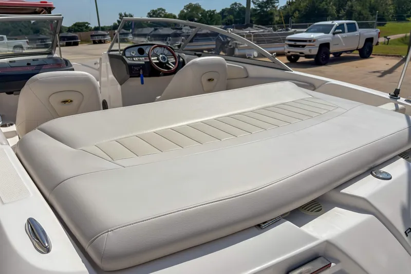 Slide: The Image of 2008 Regal 1900 Bowrider boat interior with white seating and dashboard view. - 4