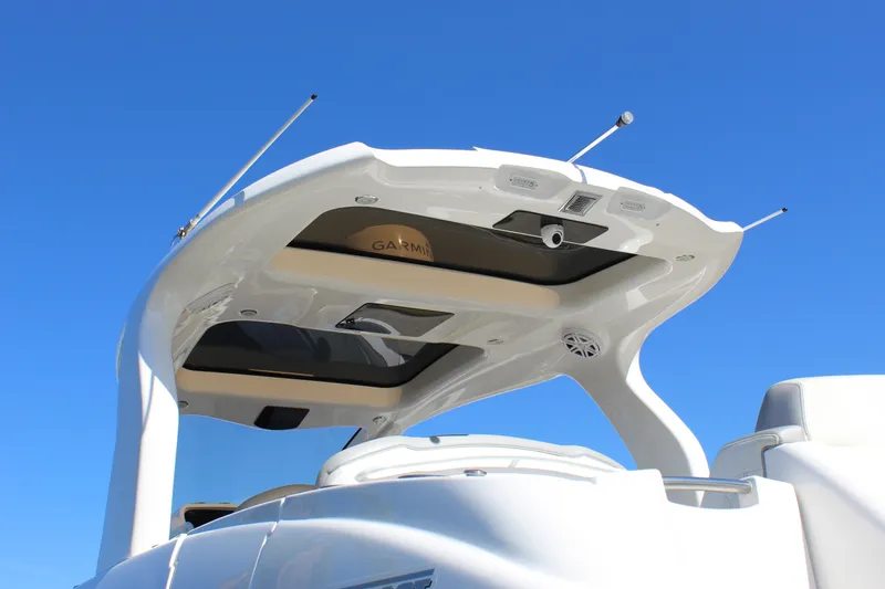 Slide: The Image of 2019 Deep Impact 399 Sport boat with sleek design against clear blue sky. - 24