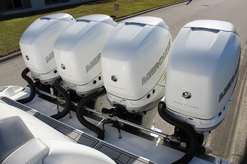 Slide: The Image of Four Mercury outboard engines on a 2019 Deep Impact 399 Sport boat. - 27