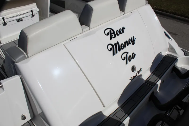 Slide: The Image of 2019 Deep Impact 399 Sport boat with "Beer Money Too" text on white seating. - 28
