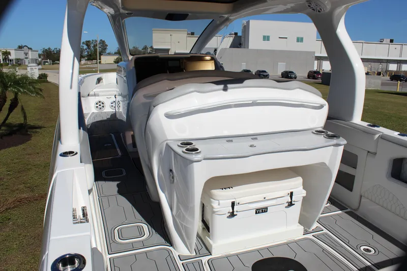 Slide: The Image of 2019 Deep Impact 399 Sport boat interior with seating and storage. - 33