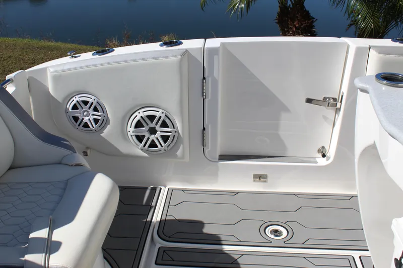 Slide: The Image of 2019 Deep Impact 399 Sport boat interior with speakers and seating. - 34