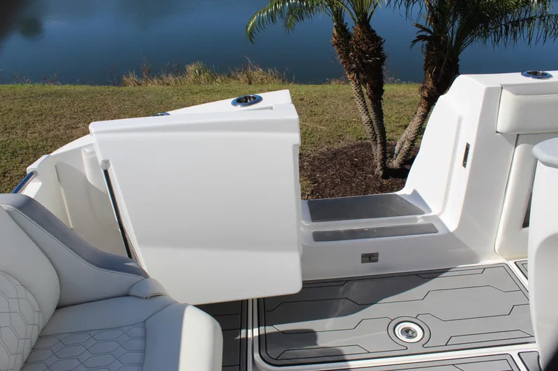 Slide: The Image of 2019 Deep Impact 399 Sport boat interior with open door and seating area. - 35