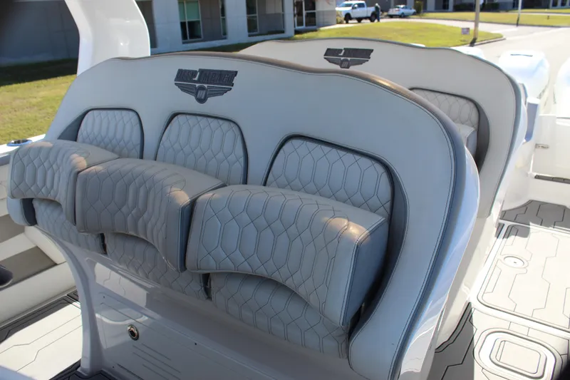 Slide: The Image of 2019 Deep Impact 399 Sport boat seats with elegant gray upholstery and modern design. - 41