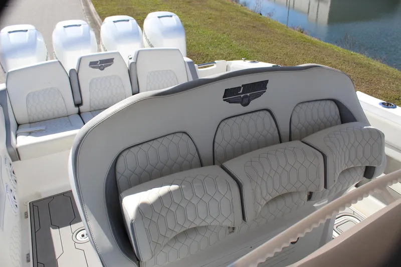 Slide: The Image of 2019 Deep Impact 399 Sport boat interior with luxurious seating and multiple engines. - 43
