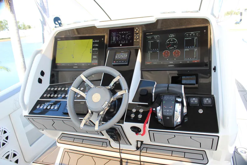 Slide: The Image of 2019 Deep Impact 399 Sport boat dashboard with advanced navigation and control systems. - 46