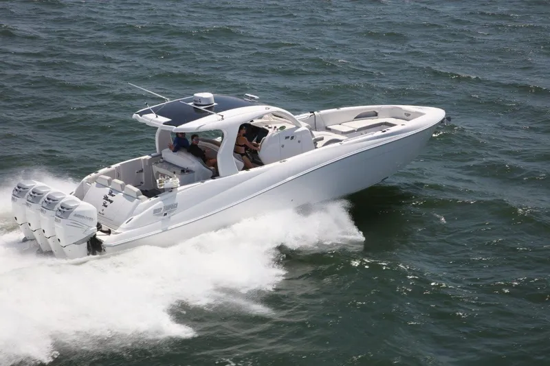 Slide: The Image of 2019 Deep Impact 399 Sport boat cruising on open water. - 75