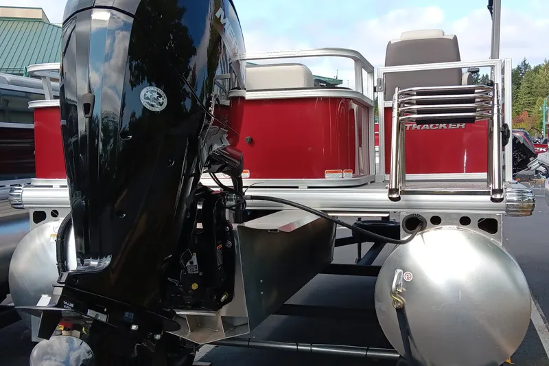 Slide: The Image of 2026 Sun Tracker Bass Buggy 18 DLX pontoon boat with powerful outboard motor. - 4