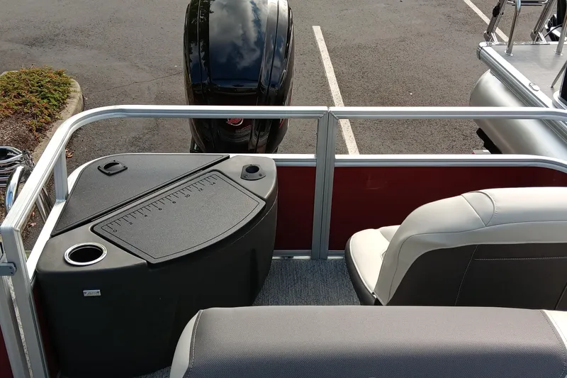 Slide: The Image of 2026 Sun Tracker Bass Buggy 18 DLX interior with seating and storage compartments. - 5