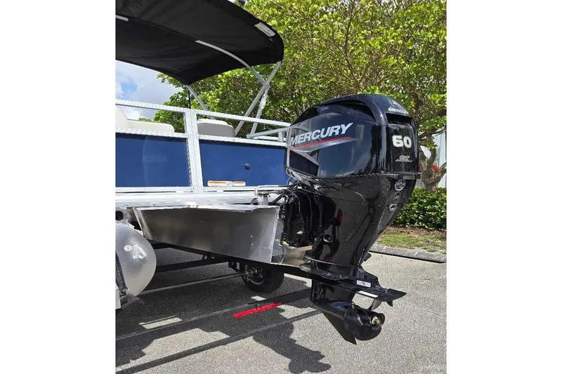 Slide: The Image of 2026 Sun Tracker Bass Buggy 18 DLX with Mercury 60 outboard motor. - 6