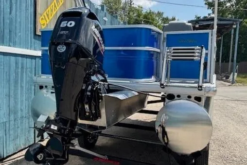 Slide: The Image of 2026 Sun Tracker Party Barge 18 DLX pontoon boat with Mercury 60 HP outboard motor. - 4