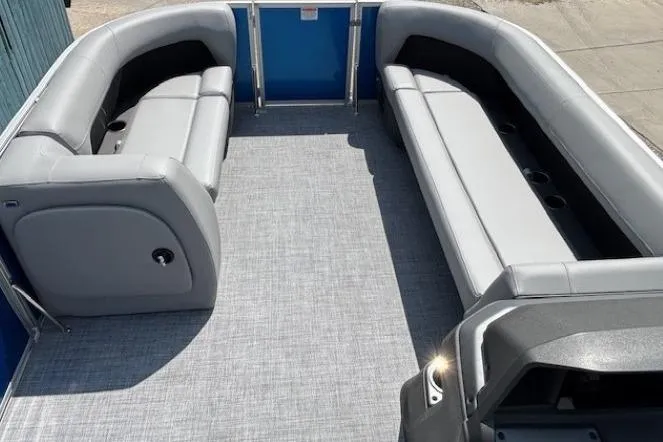 Slide: The Image of 2026 Sun Tracker Party Barge 18 DLX interior with gray seating and spacious deck. - 7
