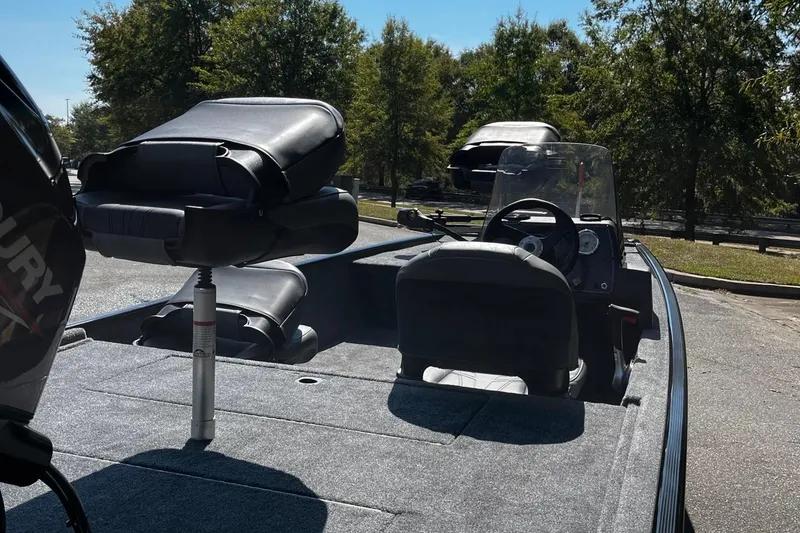 Slide: The Image of 2026 Tracker Bass Tracker Classic XL boat interior with seating and steering console. - 5