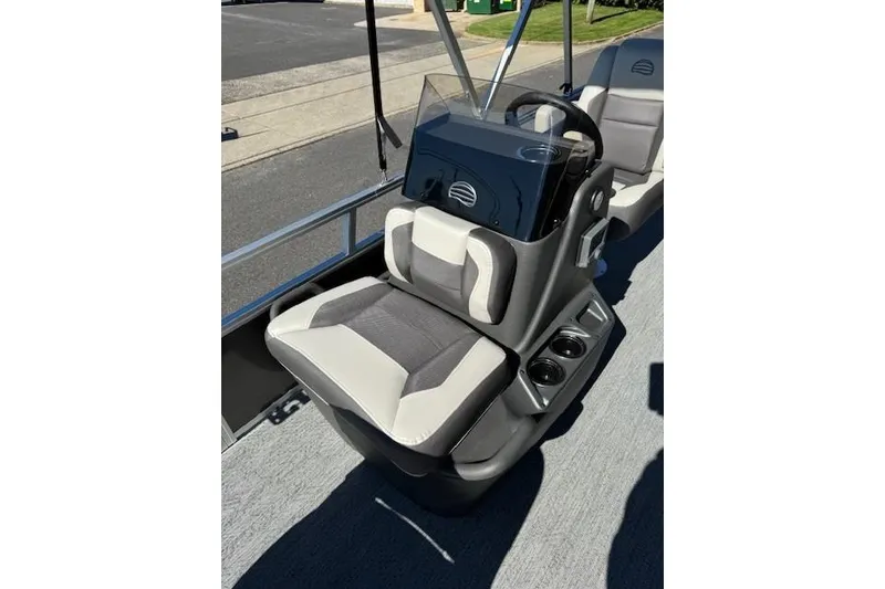 Slide: The Image of 2026 Sun Tracker Bass Buggy 16 XL Select boat interior with steering console and seating. - 16