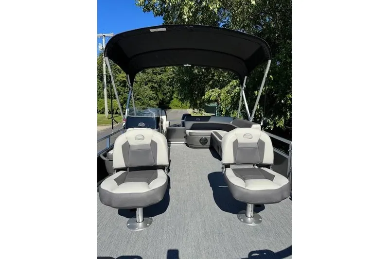 Slide: The Image of 2026 Sun Tracker Bass Buggy 16 XL Select pontoon boat with canopy and seating. - 17