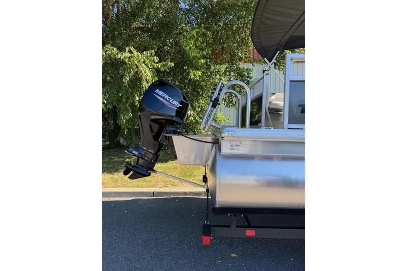 Slide: The Image of 2026 Sun Tracker Bass Buggy 16 XL Select pontoon boat with Mercury outboard motor. - 4