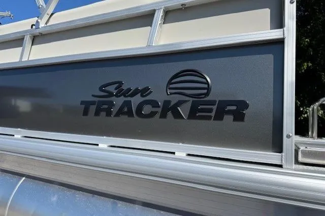 Slide: The Image of 2026 Sun Tracker Bass Buggy 16 XL Select pontoon boat logo detail. - 7