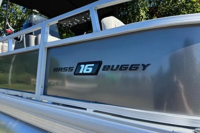 Slide: The Image of 2026 Sun Tracker Bass Buggy 16 XL Select pontoon boat side view. - 8