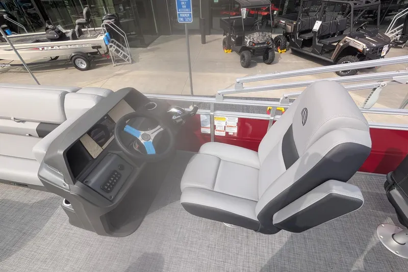 Slide: The Image of 2026 Sun Tracker SportFish 20 DLX boat interior with steering console and comfortable seating. - 13