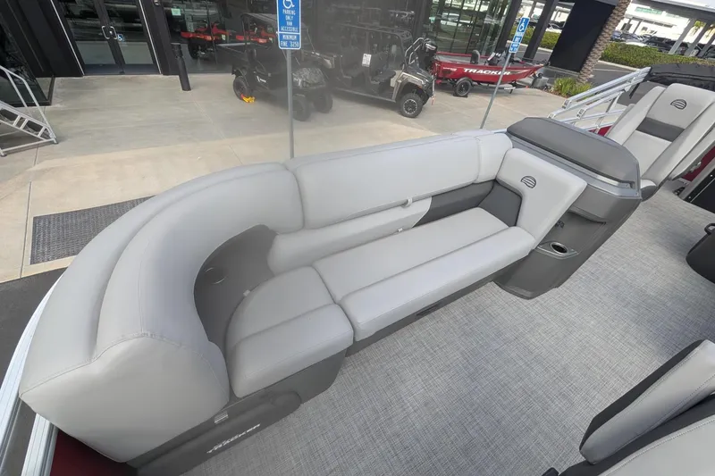 Slide: The Image of 2026 Sun Tracker SportFish 20 DLX pontoon boat with spacious seating and modern design. - 9