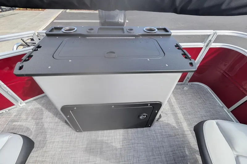 Slide: The Image of 2026 Sun Tracker SportFish 20 DLX boat interior with fishing station and rod holders. - 8