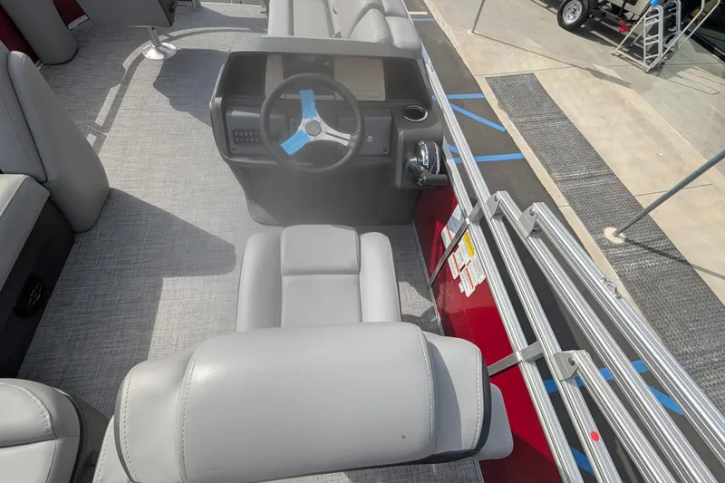 Slide: The Image of 2026 Sun Tracker SportFish 20 DLX boat interior with steering console and seating. - 11