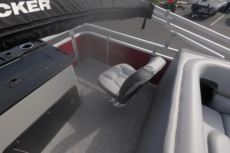 Slide: The Image of 2026 Sun Tracker SportFish 20 DLX interior with seating and console, showcasing modern design. - 7