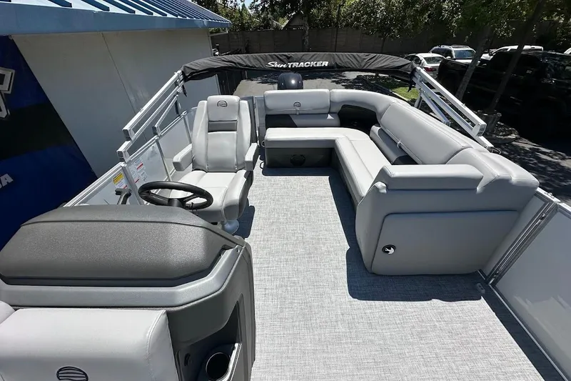 Slide: The Image of 2026 Sun Tracker Party Barge 20 DLX pontoon boat with spacious seating and modern design. - 13
