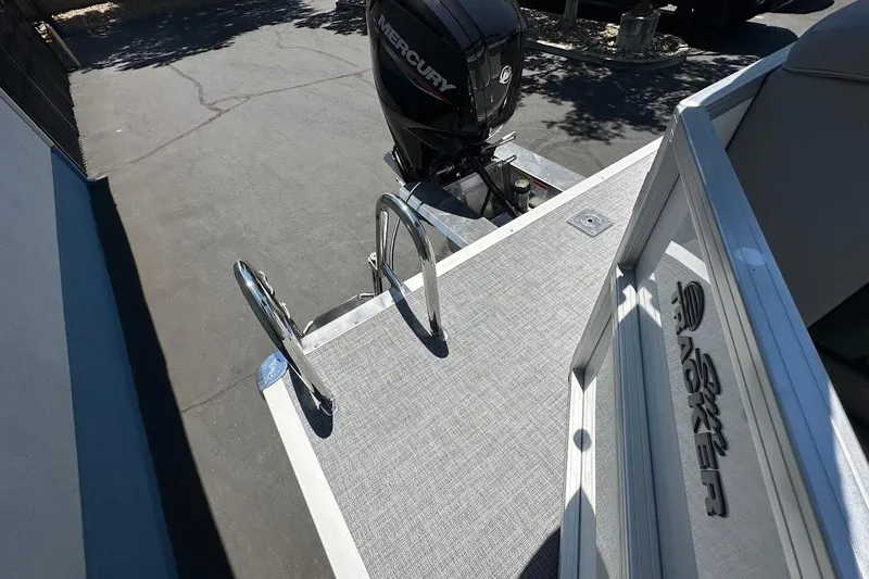 Slide: The Image of 2026 Sun Tracker Party Barge 20 DLX with Mercury outboard motor and swim ladder. - 17